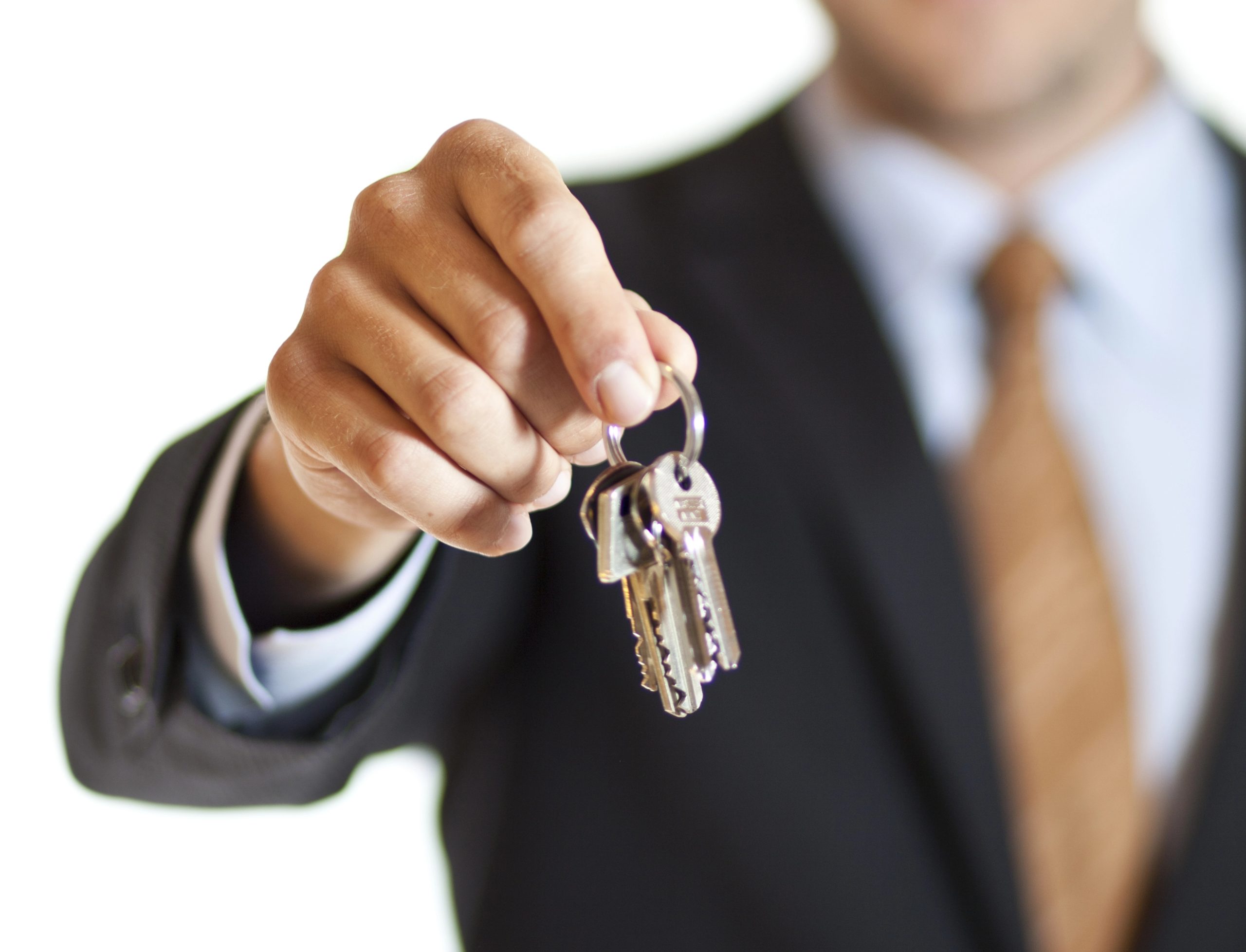 Businessman handing over keys